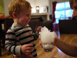 One of our Facebook fans submitted this great picture of their son watching dry ice from a Gourmet Secrets order make smoke in a glass of water.