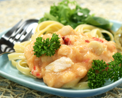 Creamy, chunky Nordique Island Seafood Sauce with shrimp, scallops and lobster pieces on top of pasta. So delicious you won't be able to get enough!